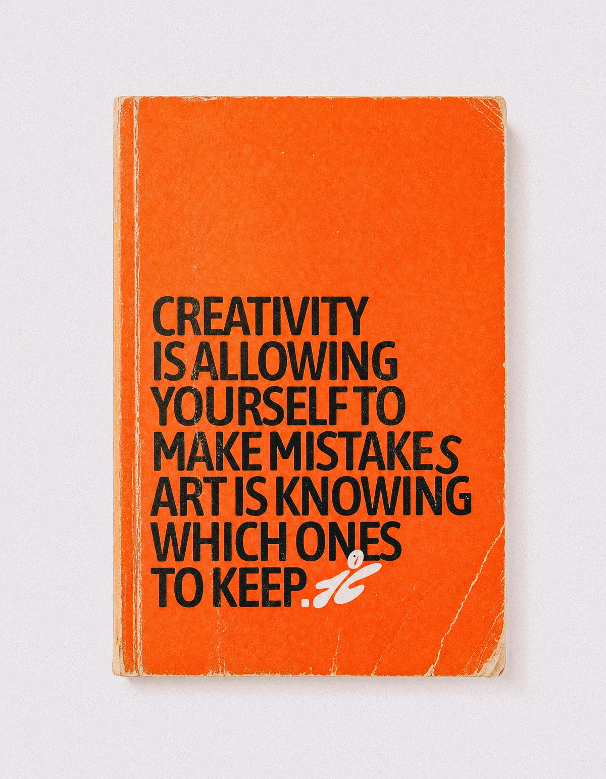 Orange mymind notebook quote graphic about creativity and keeping mistakes.
